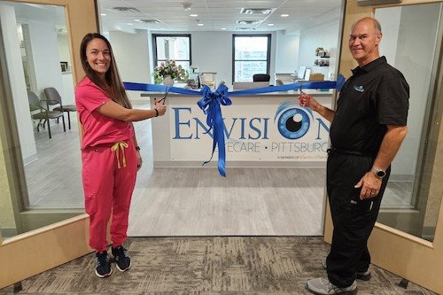 Ribbon Cutting at the entrance of the new office for Envision Eye Care